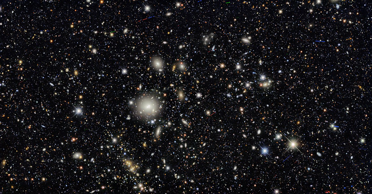 A composite image of a section of the universe taken by the Dark Energy Camera, part of an astronomical survey designed to constrain the properties of dark energy, dated May 2021 (photograph via National Optical-Infrared Astronomy Research Laboratory)