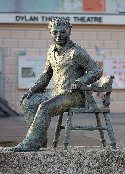 Statue of Dylan Thomas, by John Doubleday, 1984, in Dylan Thomas Square, Maritime Quarter, Swansea, Wales (photograph by Stu's Images, Wikimedia Commons)
