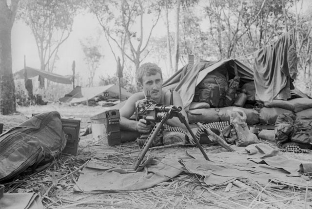 Bombardier Larry Davenport of Victor Harbor, SA, behind his M60 machine gun during Operation Toan Thang at Fire Support Base Coral in 1968  (photograph by William Alexander Errington, Australian War Memorial ERR/68/0520/VN)