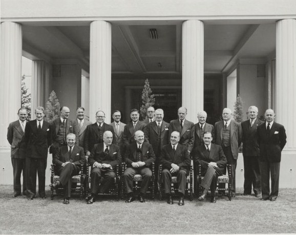 The Menzies Liberal/ Country Party Ministry in 1951. Paul Hasluck is standing at the far left (photograph via Wikimedia Commons, National Library of Australia)