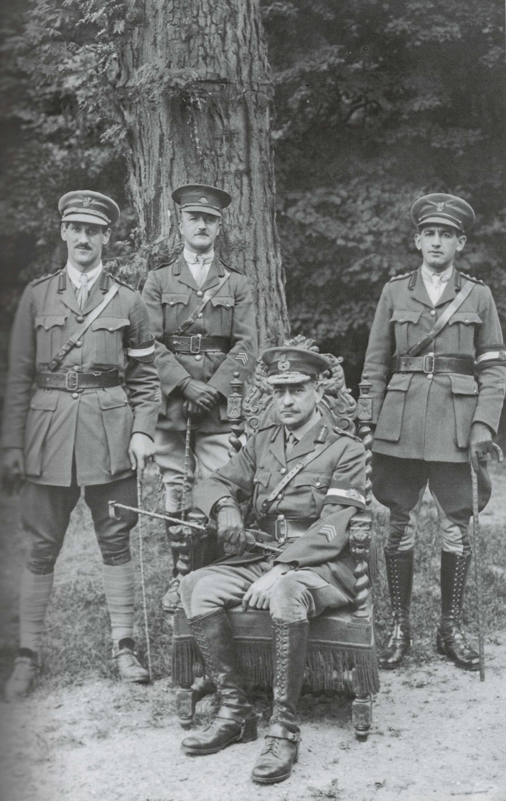 Lieutenant General Sir John Monash (seated) with his nephews and aides-de-camp Captain Aubrey Moss (left) and Captain Paul Simsonson (right), and Major Walter Berry (centre) of the Australian Corps Headquarters and Chateau Bertangles in the Somme, 20 July 1918
