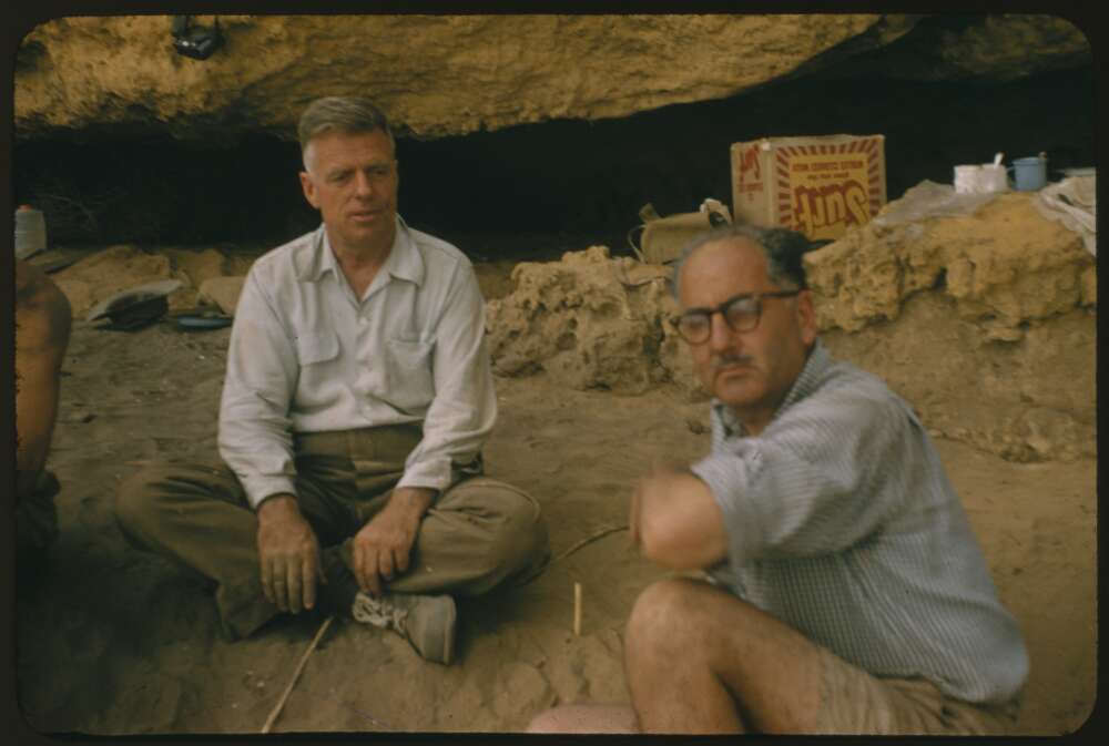N.B. Tindale, Curator of Anthropology, South Australian Museum (left) and Aldo Massola, Curator of Anthropology, National Museum of Melbourne in front of Shelter 2, Fromm's Landing, South Australia 1956 [transparency] / John Mulvaney