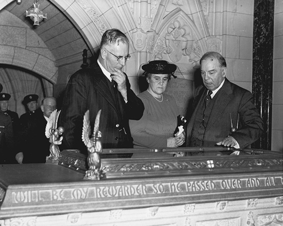 John Curtin and Mrs Curtin with Canadian Prime Minister Mackenzie King examining Book of Remembrance in Memorial Chamber Peace Tower in Parliament House Ottawa 1944 ABR Online