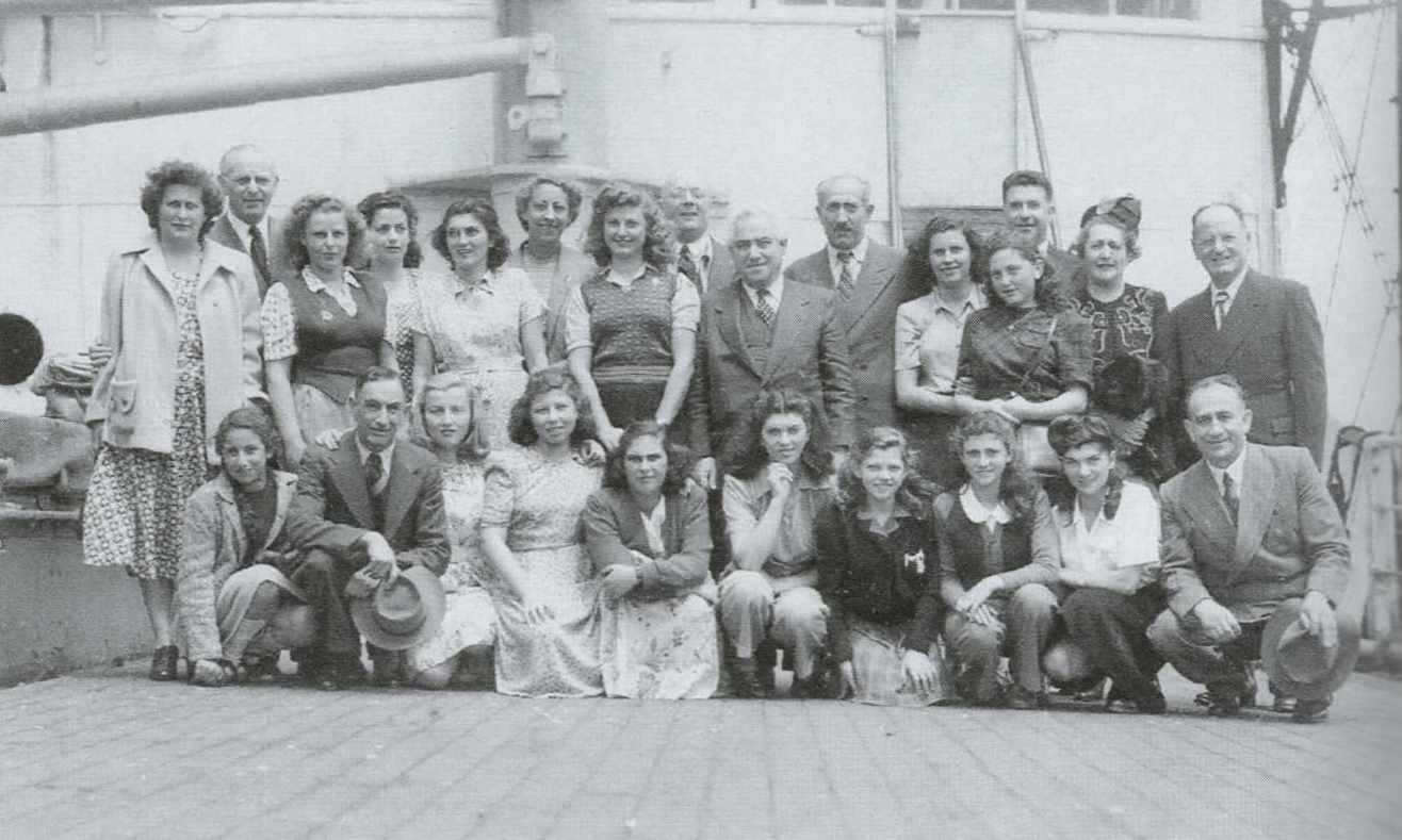 A group of new arrivals with David Abzac centre, Fremantle, Western Australia, late 1940s