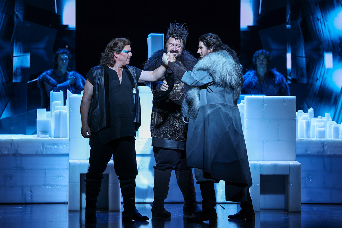 Stefan Vinke as Siegfried, Andrea Silvestrelli as Hagen, Luke Gabbedy as Gunther and the Opera Australia Chorus in Götterdämmerung (photograph by Wallis Media).